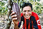 Cacao farmer showing a cacao pod
